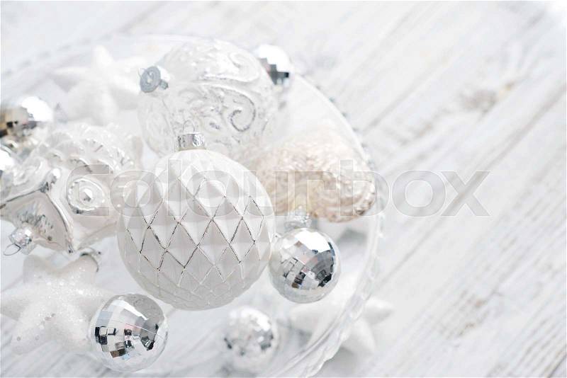 White vintage christmas balls with christmas decorations on light background, stock photo