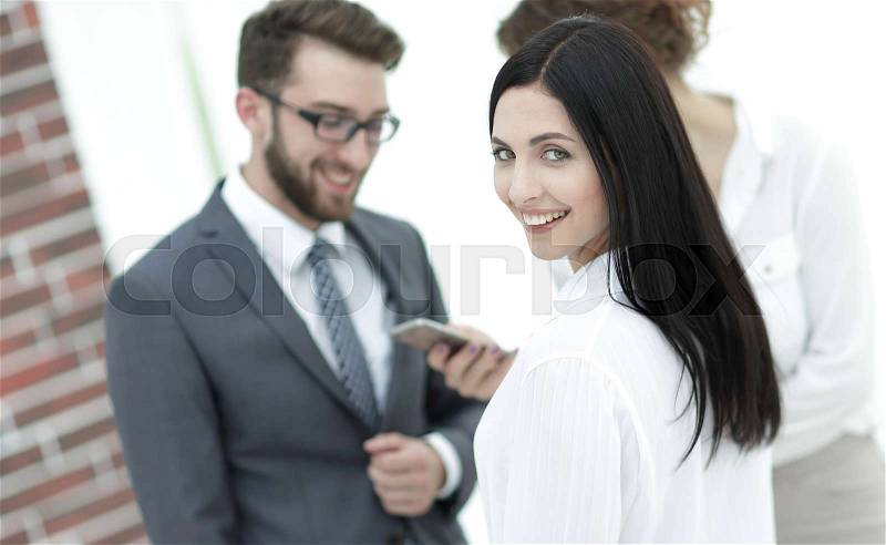 Beautiful woman manager and co-workers in the office. photo has a blank space for text, stock photo