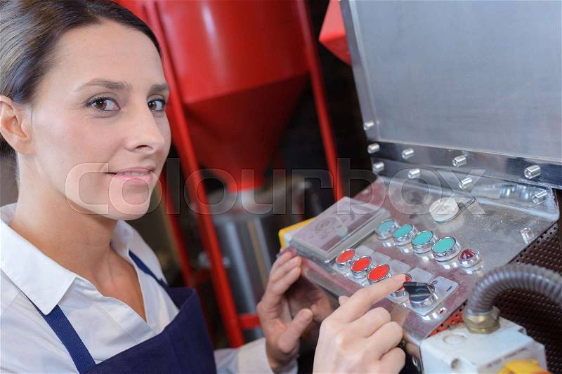 Engineer checking the temperature pipes in the control room, stock photo