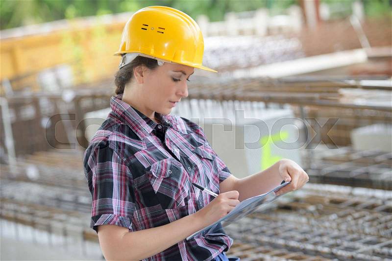 Engineer woman with clipboard, stock photo