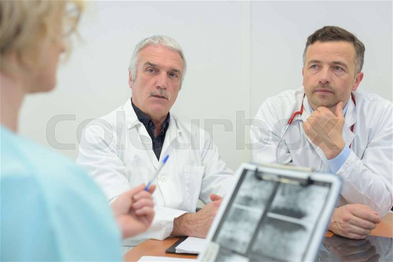 Team of doctors having a meeting in the meeting room, stock photo