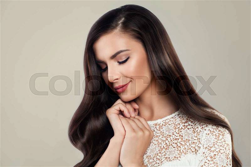 Beautiful Young Woman with Silky Hair wearing White Lacy Cloth, stock photo