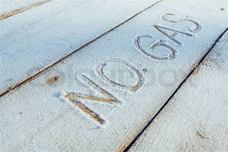 Writing on the snow. Wooden texture. Symbols on wooden board, stock photo