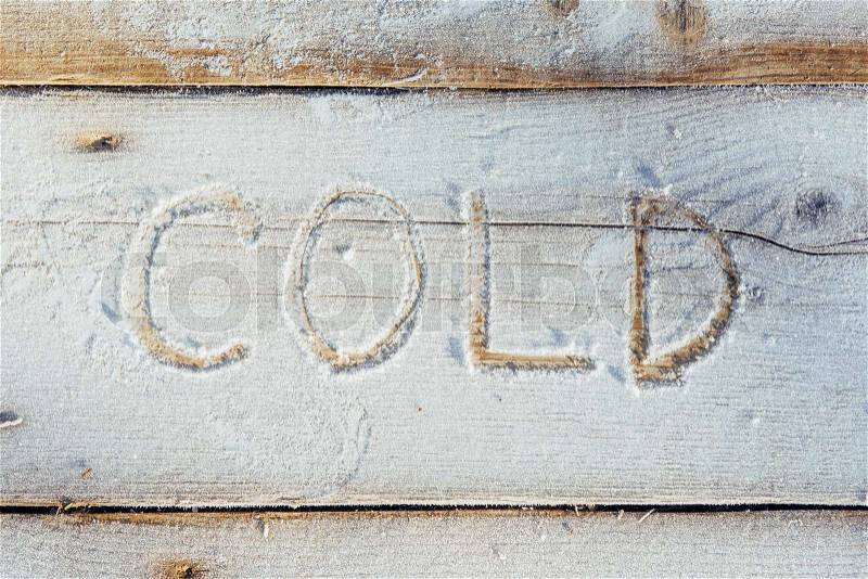Writing on the snow. Wooden texture. Symbols on wooden board, stock photo