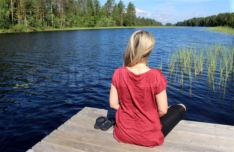 Young beautiful woman enjoy the nature of Finland, Karelia, stock photo