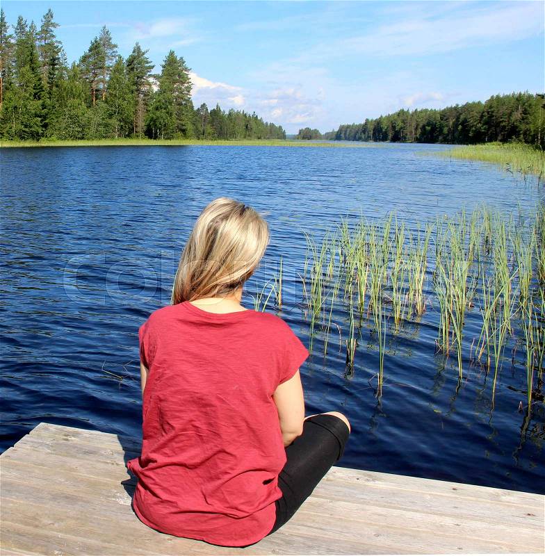 Young beautiful woman enjoy the nature of Finland, Karelia , stock photo