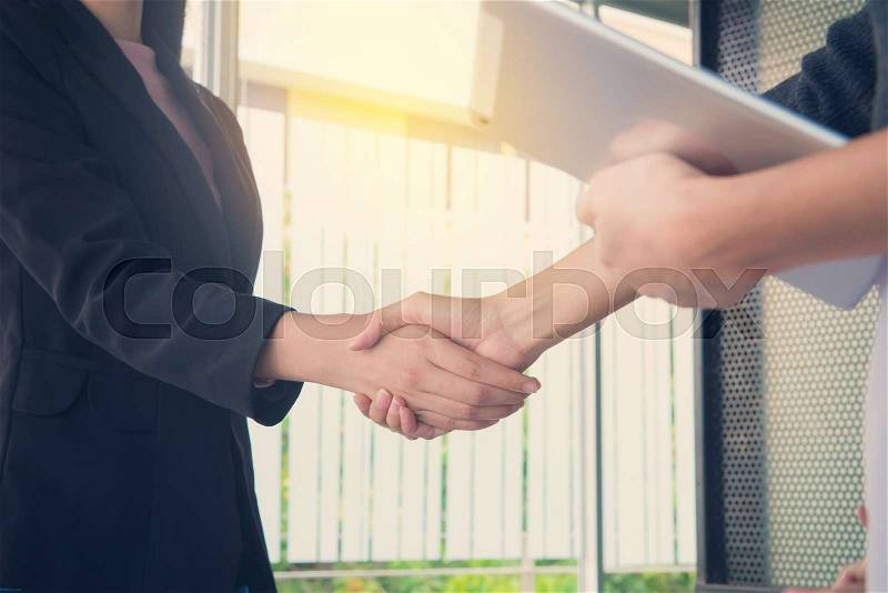 Business people handshake at meeting or negotiation in the office, Business partnership meeting concept, stock photo