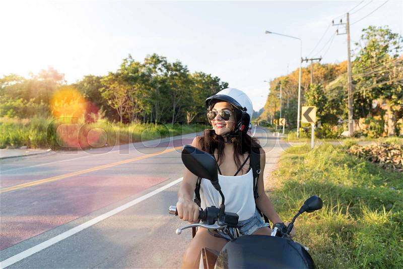 Attractive Woman On Motorcycle Wear Helemt On Countryside Road Pretty Woman Motorcyclist Travel On Motorbike Summer Trip Concept, stock photo