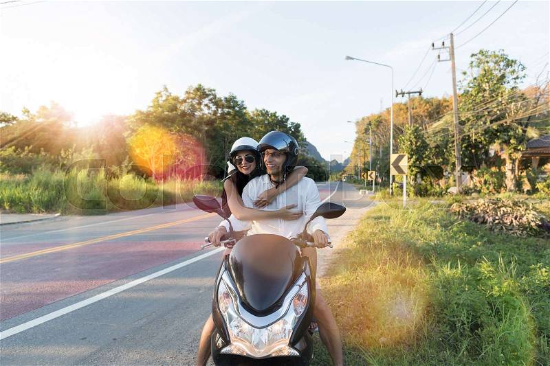 Happy Couple Riding Motorcycle In Countryside Excited Woman And Man Travel On Motorbike Summer Road Trip Concept, stock photo