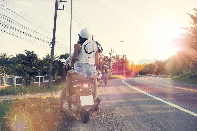 Back Rear View Of Couple Riding On Motorcycle Attractive Woman And Man Travel On Motorbike Summer Road Trip Concept, stock photo