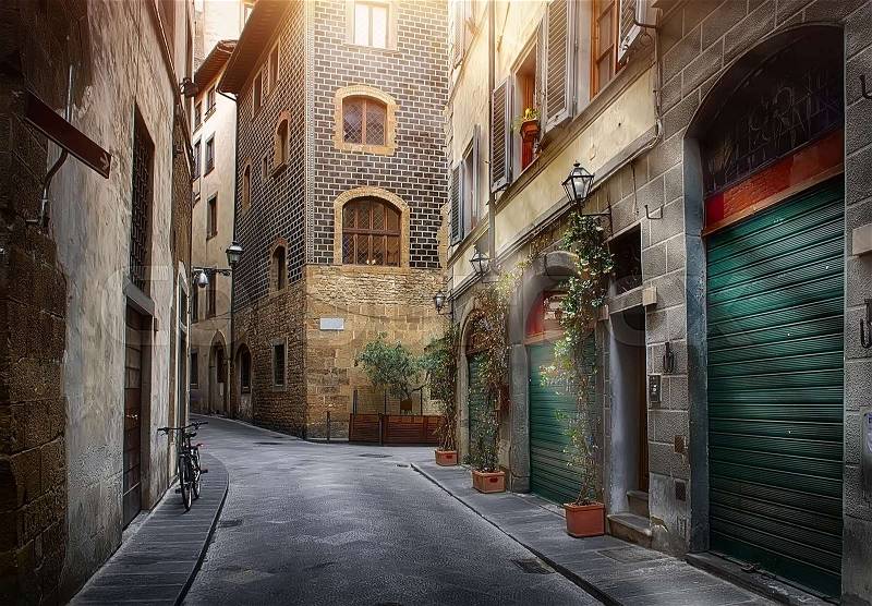 Narrow street of Florence in the morning, Italy, stock photo