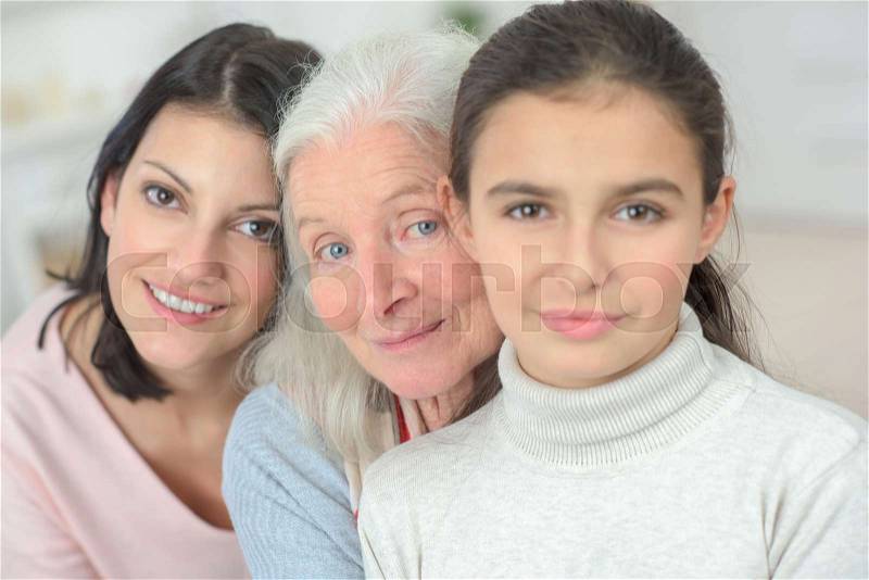 Three generations of women grandmother mother and daughter, stock photo