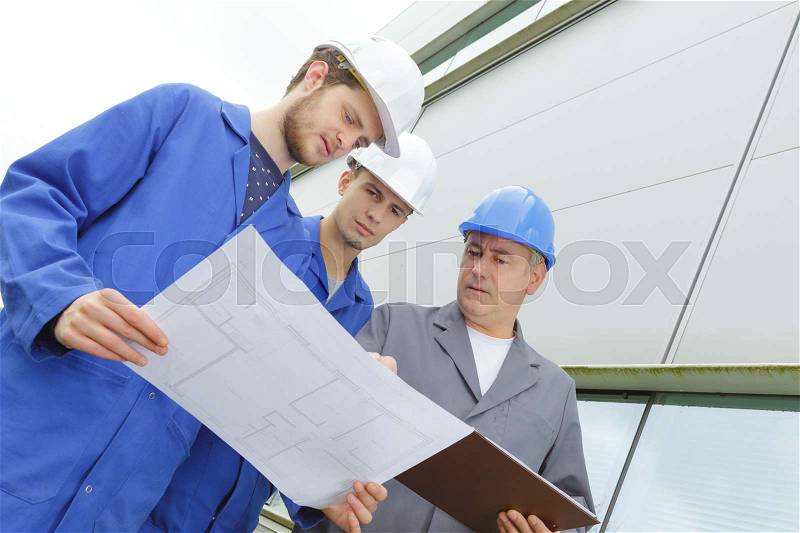 Adult with teenagers in professional training, stock photo