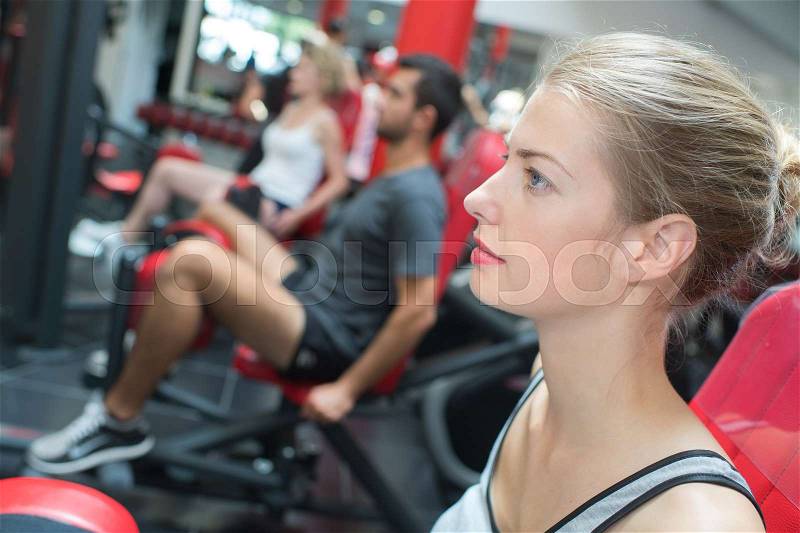 Young sporting woman in a gym, stock photo