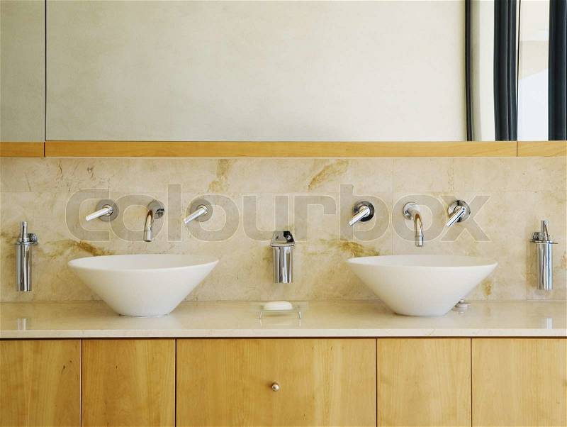 Modern bathroom vanity and sinks can be as background, stock photo