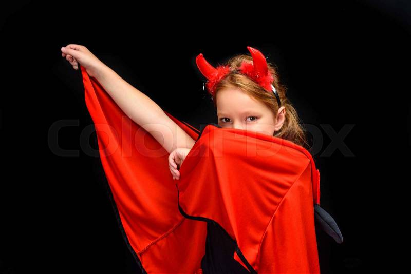 Kid in halloween costume of devil, isolated on black , stock photo