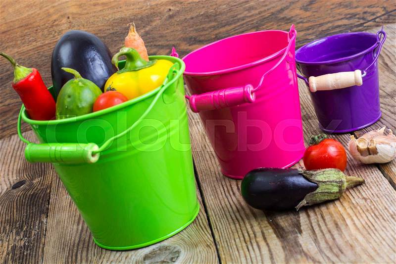 Autumn seasonal vegetables in metal bucket on wooden background. Studio Photo, stock photo