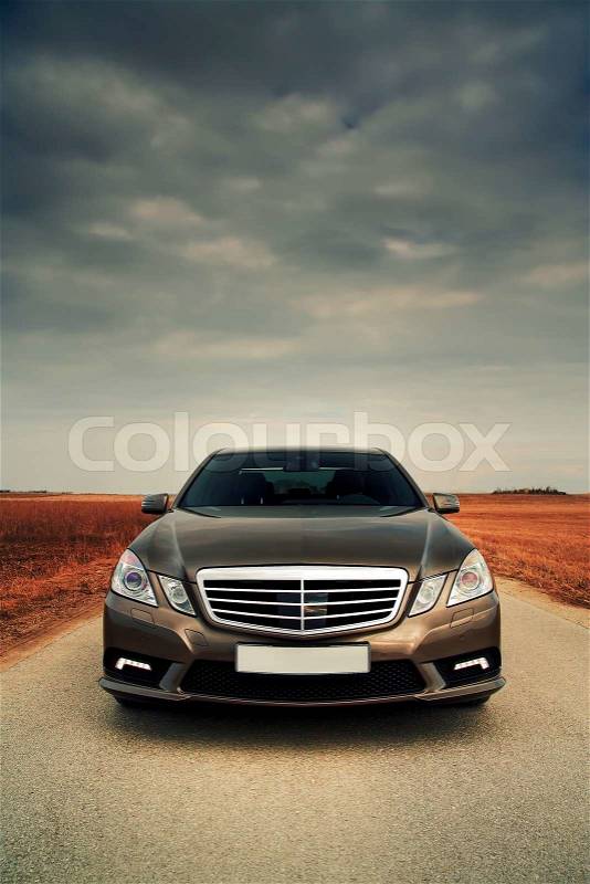 Wide front view of modern sporty saloon, stock photo