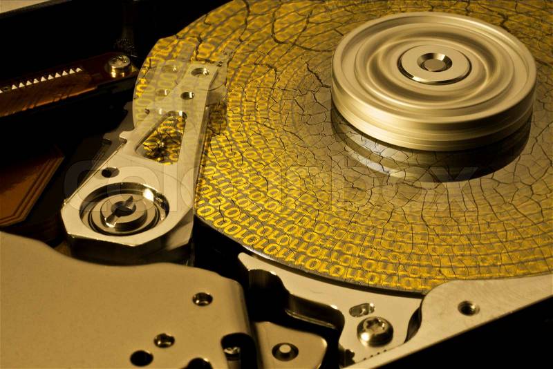 Symbolic data rescue theme showing a opened hard disk with symbolic corroded surface, stock photo