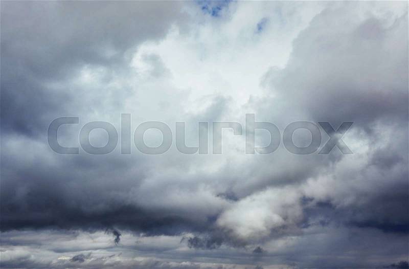 Background of dark clouds before a thunder-storm. Dramatic sky, stock photo