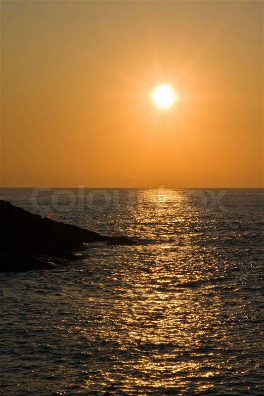 Beautiful orange sunrise above the sea, stock photo