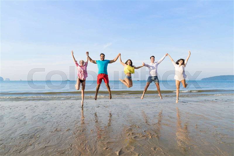 Young People Group Jump On Beach Summer Vacation, Happy Smiling Friends Sea Ocean Holiday Travel, stock photo