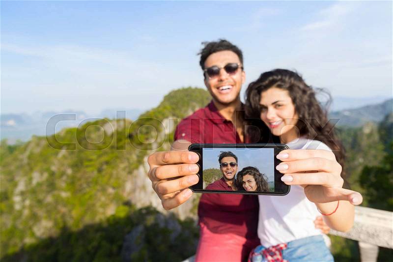 Young Couple Mountain View Point Happy Smiling Man And Woman Taking Selfie Photo On Cell Smart Phone Asian Holiday Summer Vacation Travel, stock photo