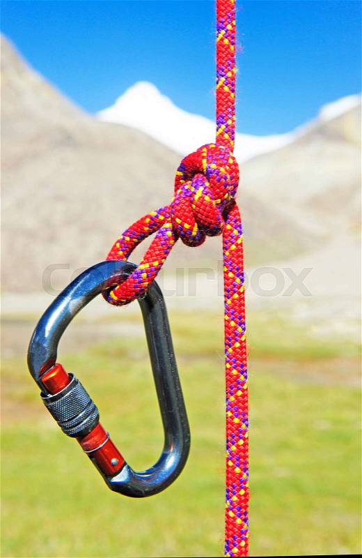 Climbing equipment - carabiner and rope, stock photo