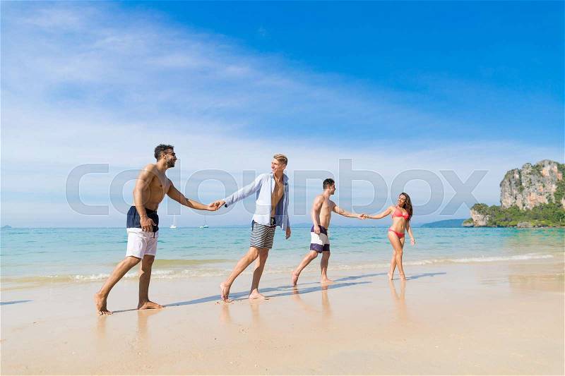 Two Couple On Beach Summer Vacation, Young People In Love Walking, Man Woman Holding Hands Sea Ocean Holiday Travel, stock photo