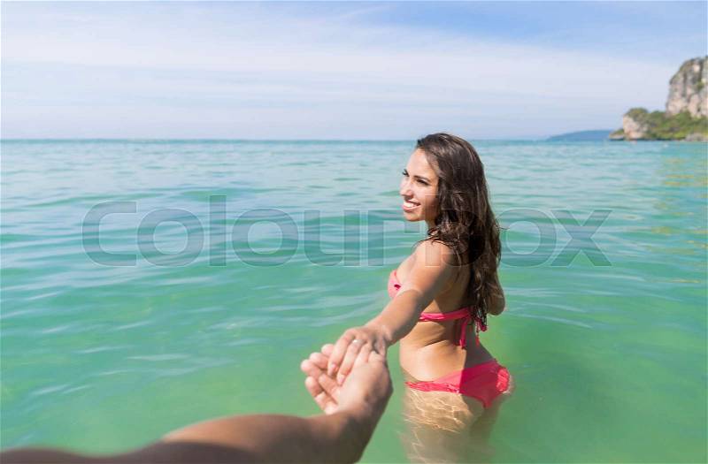 Couple On Beach Summer Vacation, Young People In Water , Man Woman Holding Hands Sea Ocean Holiday Travel, stock photo