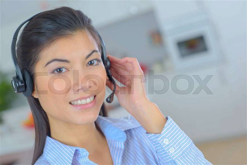 Beautiful cute call center woman smiles friendly, stock photo