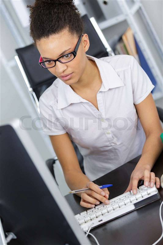 Portrait of afro american business woman working in the office, stock photo