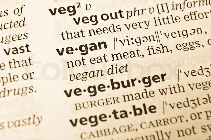 The word vegan in the old dictionary Selective focus effect, stock photo