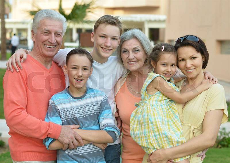 Portrait of happy smiling family at resort, stock photo