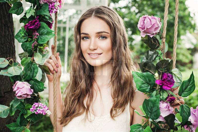Beautiful Young Woman with Rose Flowers Outdoors, Natural Beauty, stock photo