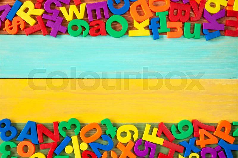 Border of colorful fridge magnets with copy-space, stock photo