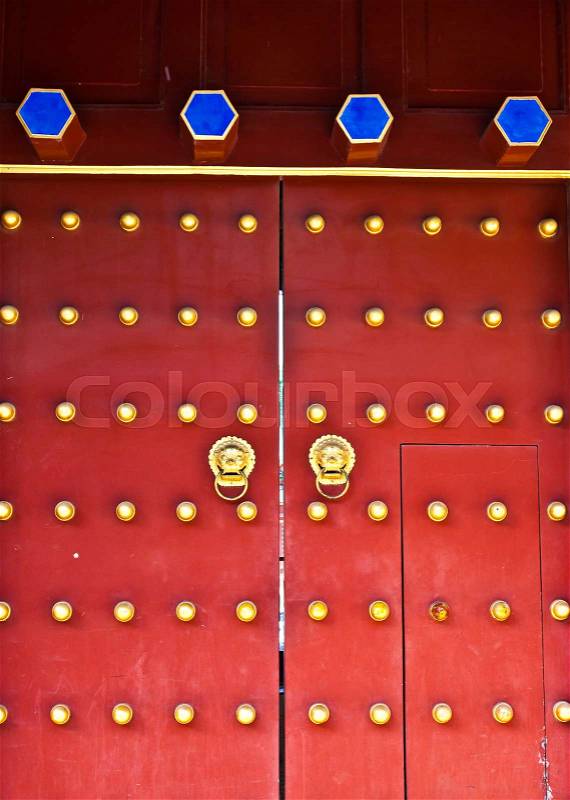 Red door in hutong area, close to Forbidden City, Beijing, China, stock photo