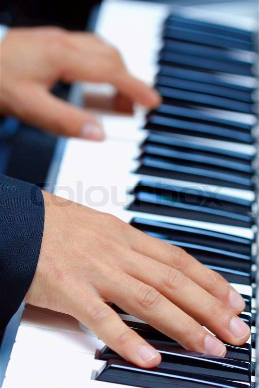 Artist hands of a piano player, stock photo