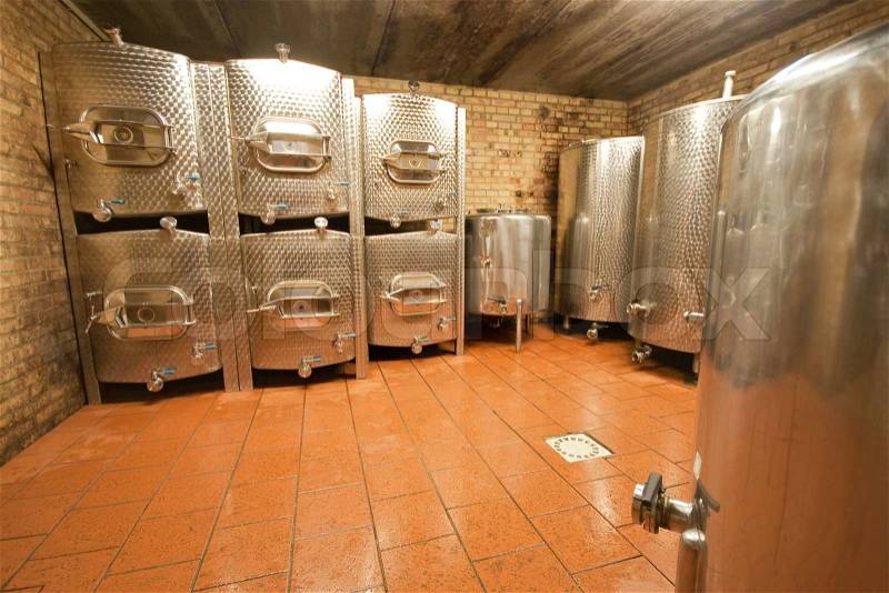 Fermentation tanks in the wine cave, stock photo