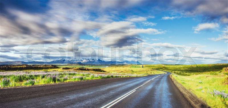 Road in mountains. Bridge over a channel connecting Jokulsarlon Lagoon and Atlantic Ocean in southern Iceland, stock photo