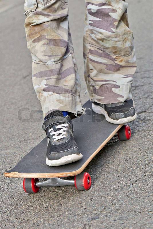 BRUSSELS, BELGIUM - SEPTEMBER 17, 2017: Young teenager boy practice skateboarding during the Car Free Streets day on Lambermont Blvd. in Brussels, Belgium, stock photo