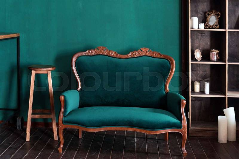 Antique wood sofa couch in vintage room. Classical style armchair, stock photo