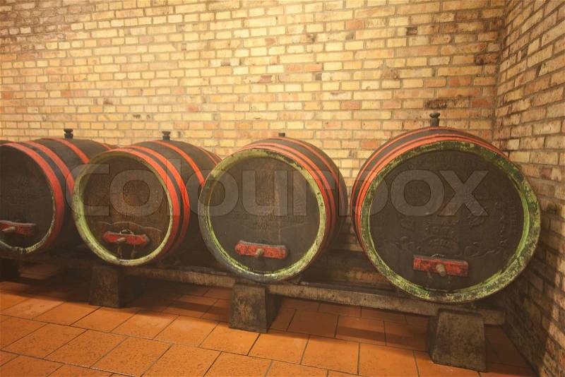 Wine barrels in old wine cave, stock photo