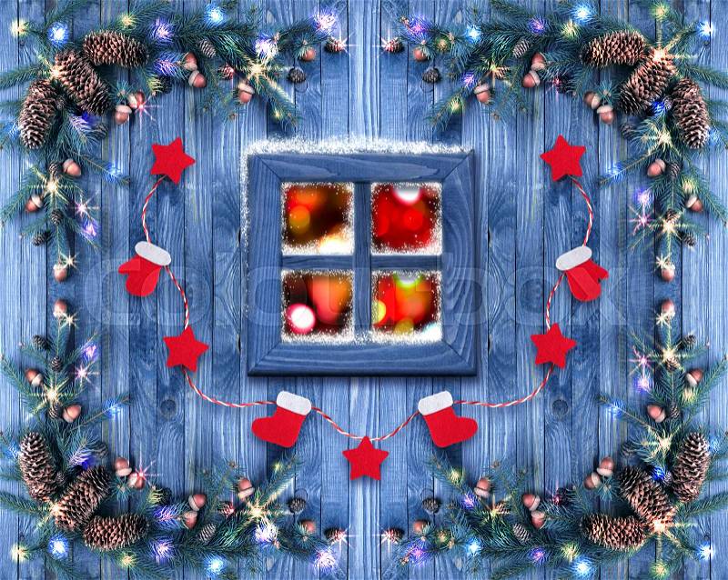 Christmas wooden window decorated with New Year decor in rustic vintage style with light illumination and spruce. Winter holidays concept, stock photo