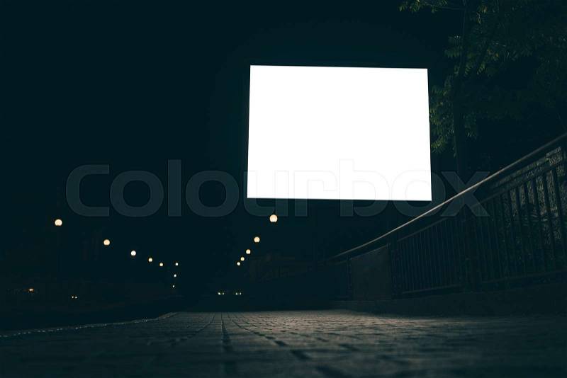 Blank advertising screen in the street at night, low angle shooting, stock photo