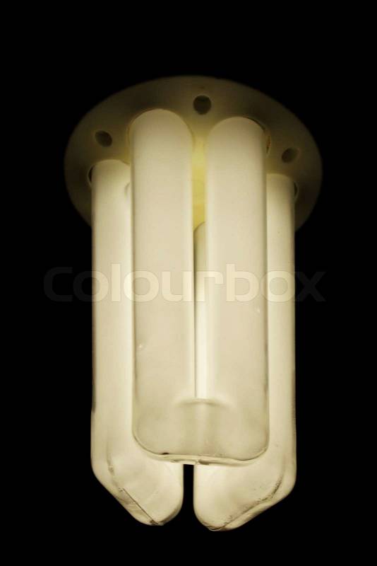 Compact fluorescent light bulb on black background, stock photo