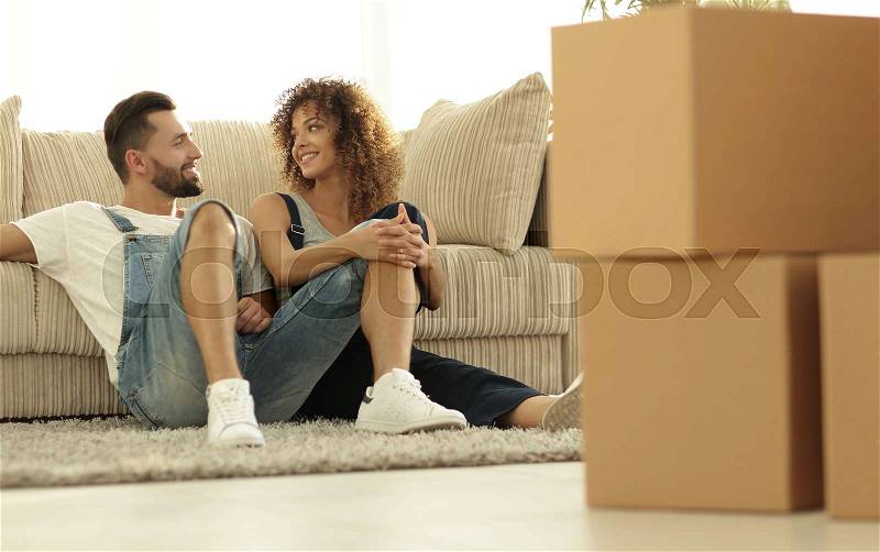 Happy family plans its future in a new home. Reliable investments, stock photo