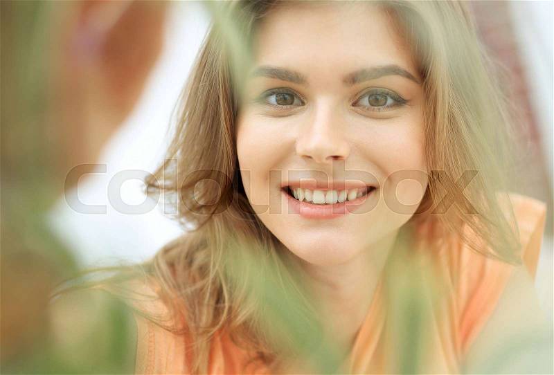 Portrait of smiling woman face on blurred background.photo with copy space, stock photo
