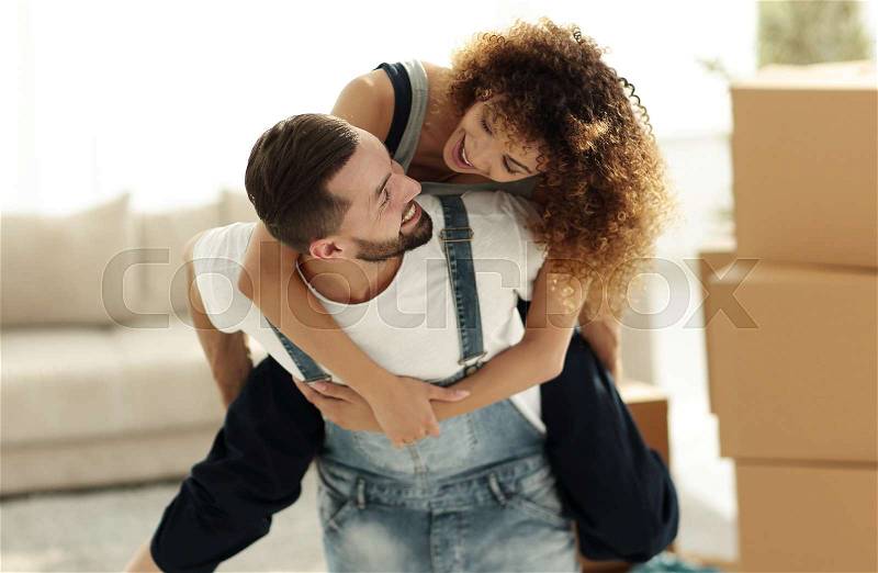 Wife and husband are happy to move to a new home. Family and real estate, stock photo