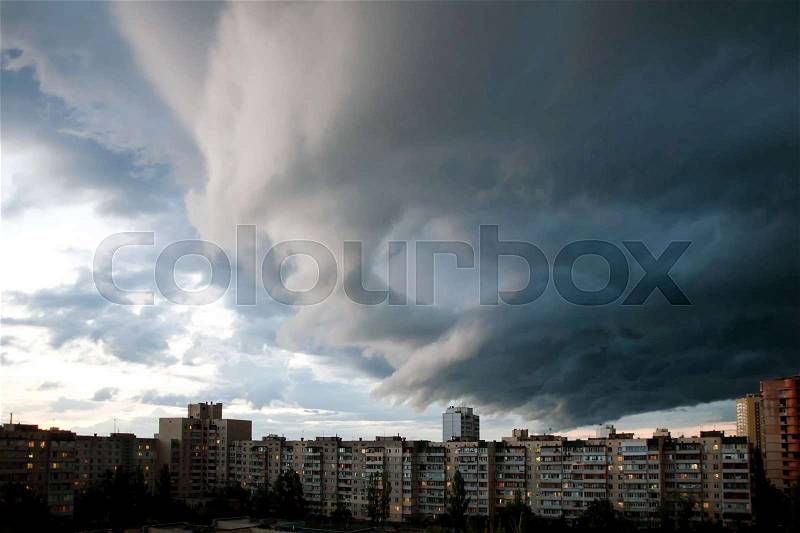 Heavy rain clouds over the city. Stormy sky over the buildings. Typical modern residential district. Kiev, Ukraine, stock photo